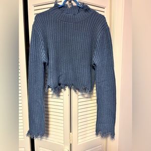 Distressed crop sweater